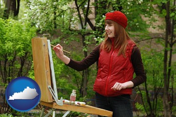 a female plein air artist painting with oils on a portable easel - with Kentucky icon