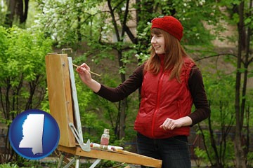 a female plein air artist painting with oils on a portable easel - with Mississippi icon