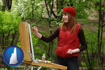 a female plein air artist painting with oils on a portable easel - with New Hampshire icon