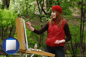 a female plein air artist painting with oils on a portable easel - with New Mexico icon