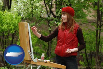 a female plein air artist painting with oils on a portable easel - with Tennessee icon